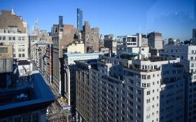 Raster graphic of nyc street. Blue sky with buildings